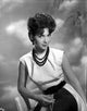 Suzanne Pleshette wearing a white dress and black beads necklace photo print.