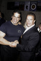 Arnold Schwarzenegger and Lou Ferrigno handshake photo print from the 25th Anniversary of Pumping Iron event.