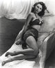 Ava Gardner lounging on a couch in vintage swimwear photo print