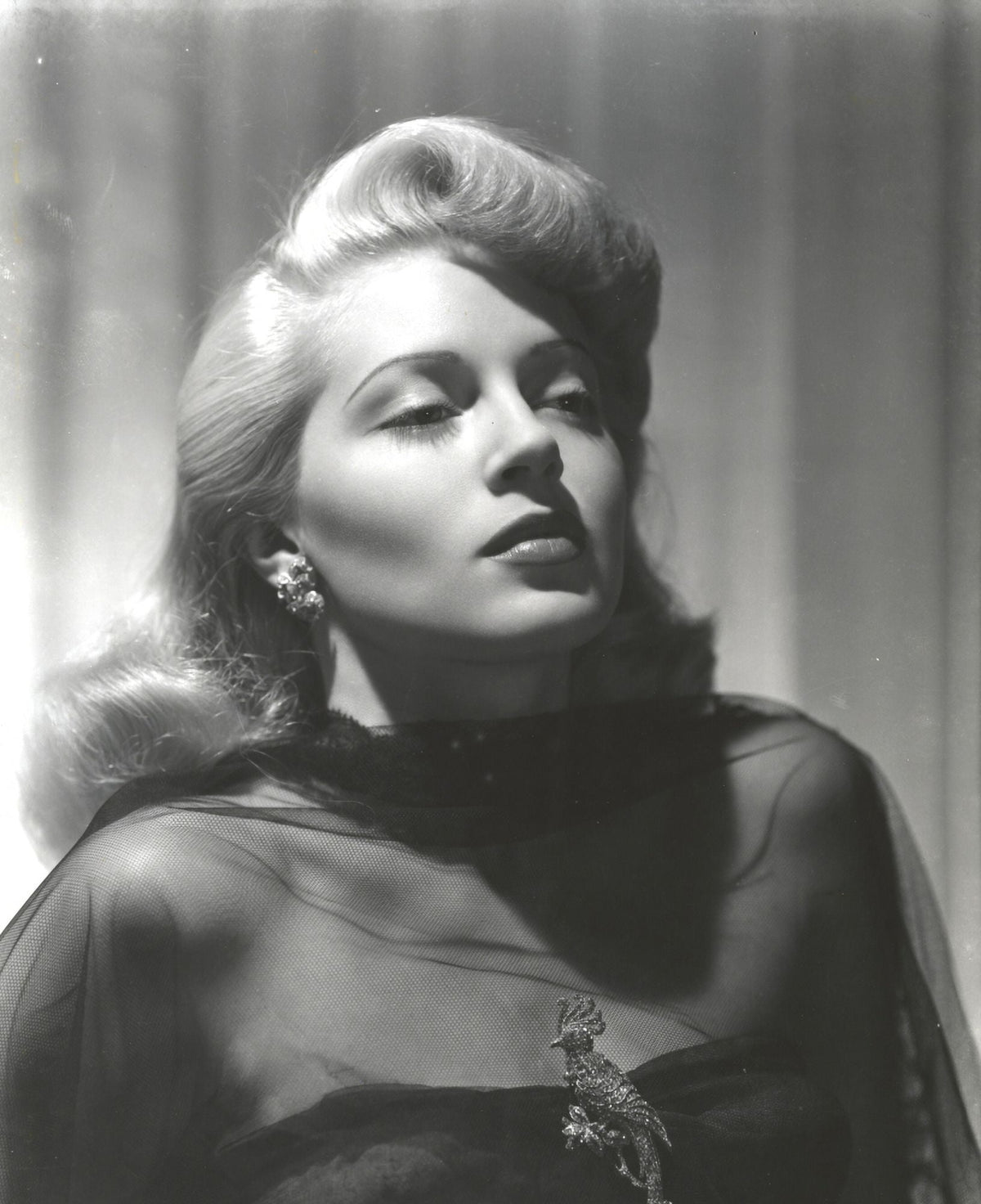 Close-up portrait of Lana Turner with closed eyes, photo print.