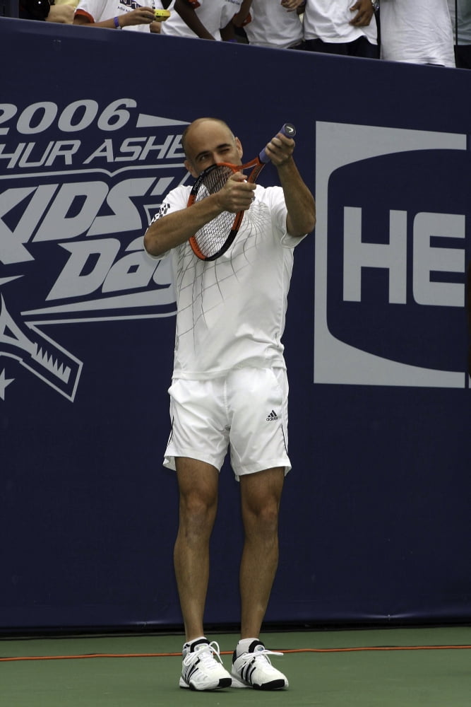 Andre Agassi action photo print showcasing tennis legend.