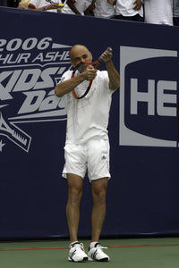 Andre Agassi action photo print showcasing tennis legend.
