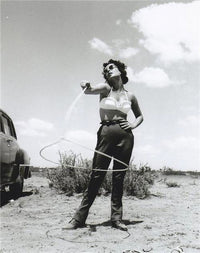 Elizabeth Taylor twirling lasso photo print, showcasing iconic Hollywood glamour.