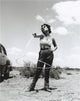 Elizabeth Taylor twirling lasso photo print, showcasing iconic Hollywood glamour.