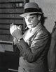 James Cagney smoking a cigarette wearing a fedora film still photo print.