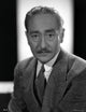 Portrait of Adolphe Menjou photo print showcasing classic Hollywood style.