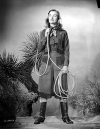 Ella Raines holding rope in cowboy attire photo print.