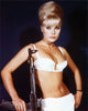Elke Sommer holding rifle photo print in multiple sizes.