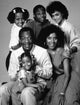 The Cosby Show cast photo print featuring iconic sitcom characters.