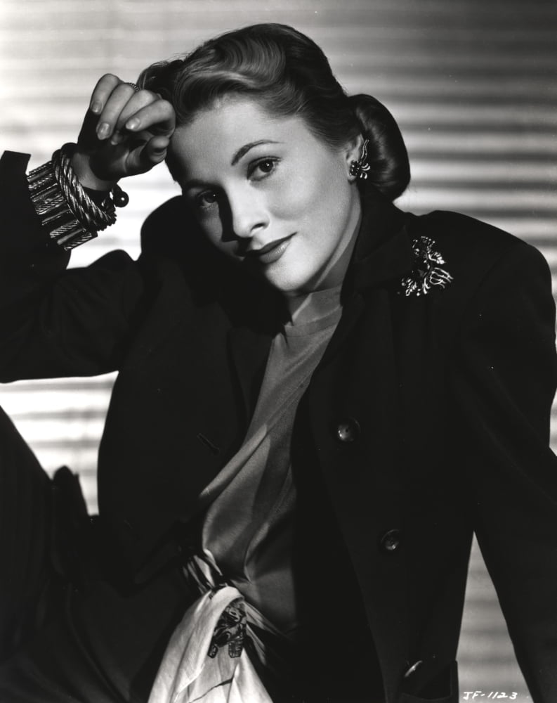Joan Fontaine leaning in a black suit photo print