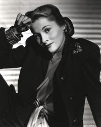 Joan Fontaine leaning in a black suit photo print
