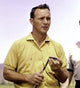 Arnold Palmer in Yellow Photo Print showcasing classic golf style.