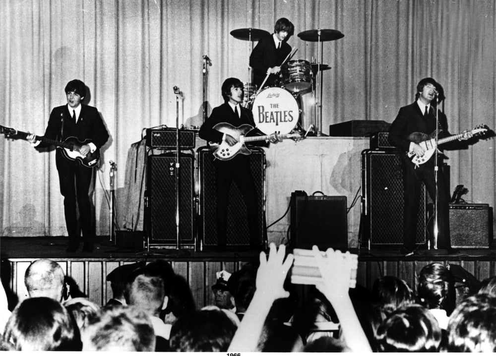 The Beatles live performance photo print showcasing the iconic band