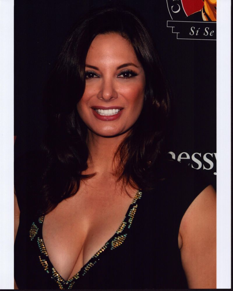 Alex Meneses photo print in low cut black top, stylish and elegant.