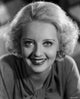 Bette Davis smiling portrait photo print in long sleeve shirt.