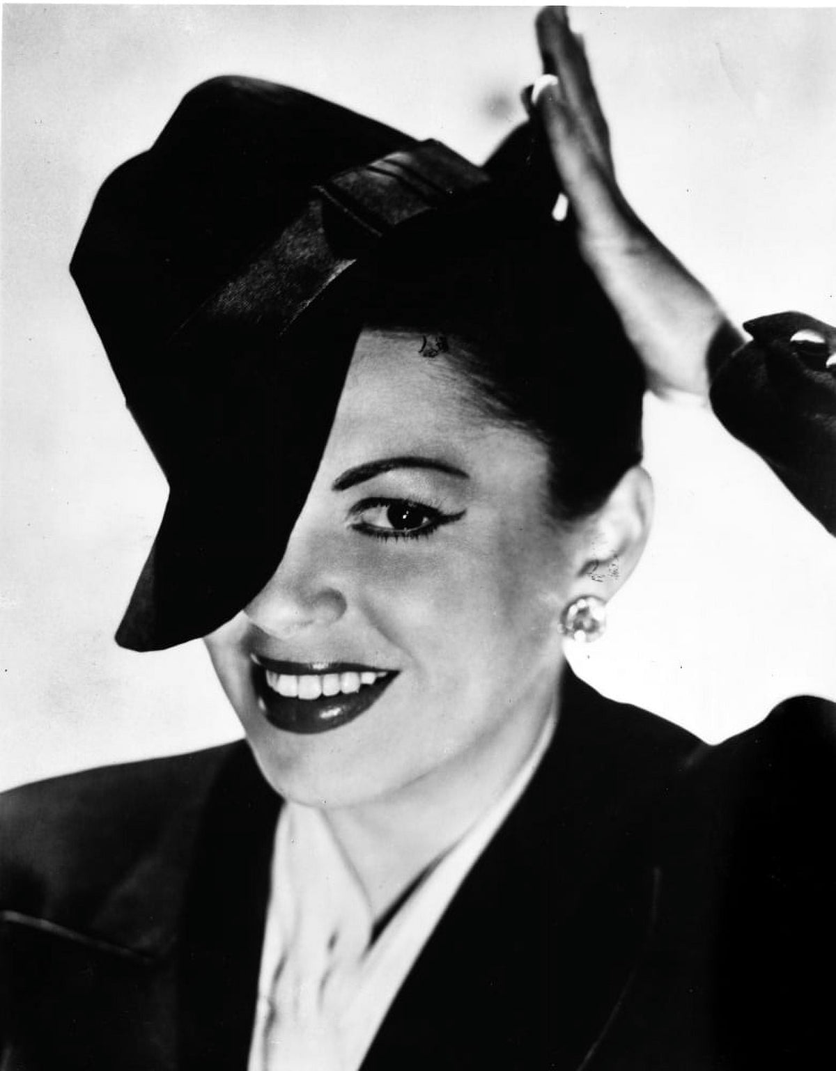Judy Garland portrait photo print with tipped hat, classic Hollywood art.