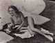 Betty Grable Writing Photo Print showcasing classic Hollywood elegance.