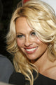 Pamela Anderson at New Year's Eve Party photo print by James Atoa