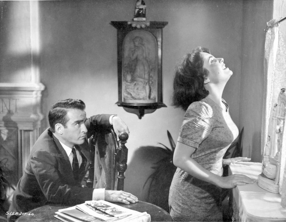 Suddenly Last Summer black and white photo print featuring a couple looking out the window.