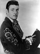 Guy Williams wearing a floral jacket photo print in 8 x 10 size.