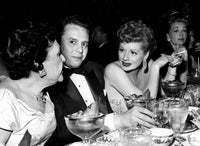 Lucille Ball talking at a table photo print, capturing her vibrant personality.