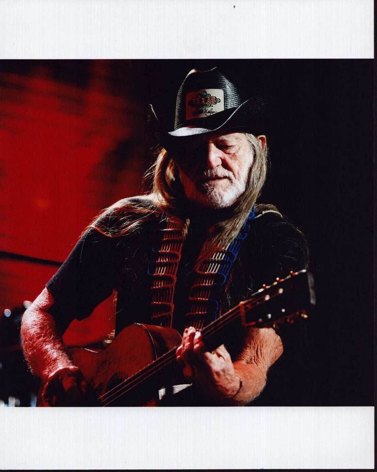Willie Nelson photo print playing guitar in black cowboy hat.