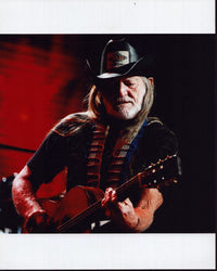 Willie Nelson photo print playing guitar in black cowboy hat.
