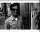 Spike Jonze black and white photo print on street corner with sunglasses