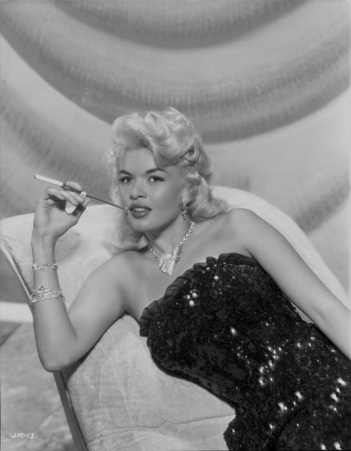 Jayne Mansfield photo print in black sequin dress on white silk couch