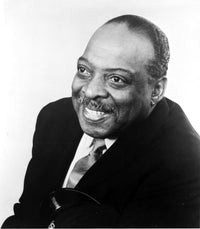 Count Basie Photo Print showcasing the jazz legend in a classic pose.