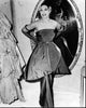 Josephine Baker in sleeveless gown in front of mirror photo print.