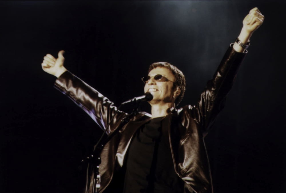 Robin Gibb performing live photo print, capturing the iconic artist in action.