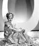 Joan Bennett in gold lame negligee photo print from Artists And Models Abroad 1938.