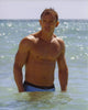 Daniel Craig Beach Photo Print showcasing the actor in a relaxed pose.