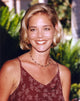 Christina Moore posed in an elegant dress with a hairband photo print