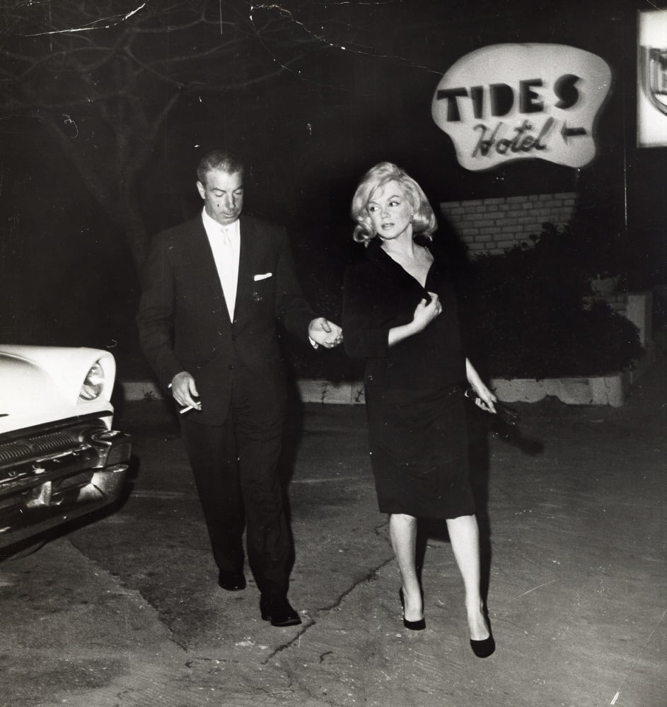 Marilyn Monroe and Joe DiMaggio photo print capturing a classic Hollywood moment.
