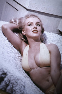 Marilyn Monroe lounging in a bikini photo print