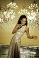 Eartha Kitt singing photo print with chandeliers in the background.