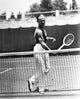 Fred Astaire playing tennis in a classic black and white portrait photo print.