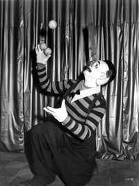 Emmett Kelly juggling in clown attire photo print.