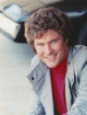 David Hasselhoff smiling in grey coat photo print.