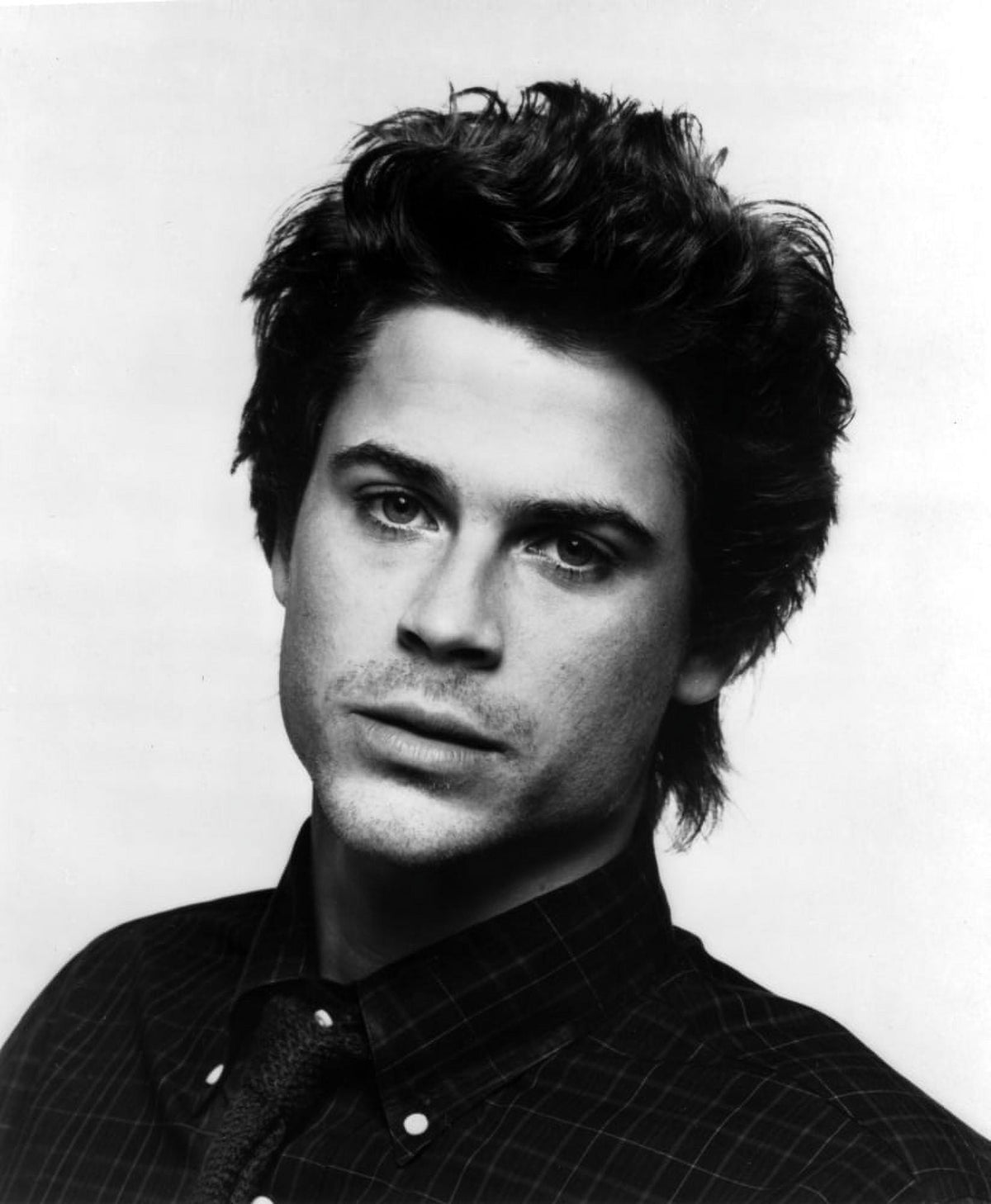 Rob Lowe iconic photo print showcasing the actor's charm.