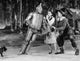Black and white photo print of Tin Man leaning on Dorothy from The Wizard of Oz.