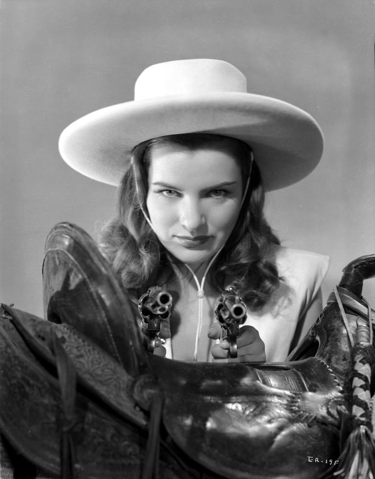 Ella Raines serious pose in cowgirl outfit photo print.