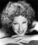 Bette Midler portrait photo print with fingers crossed and chin on hand.