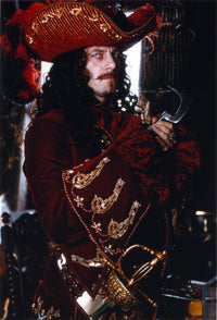 Jason Isaacs in a pirate outfit photo print, available in multiple sizes.