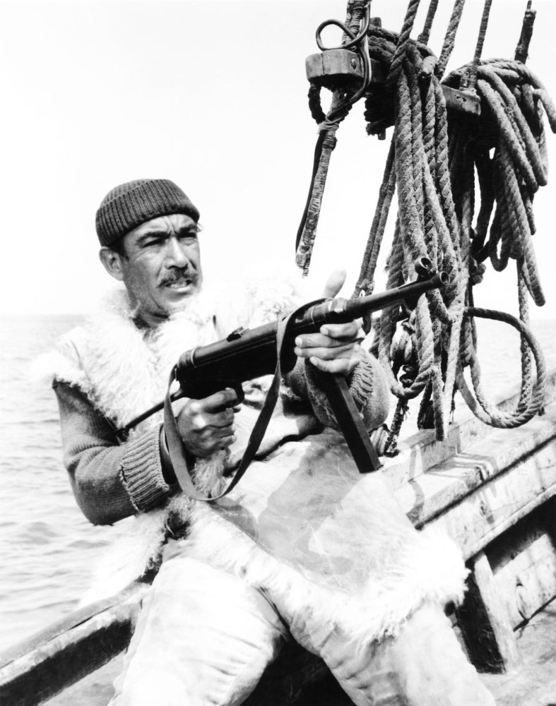 The Guns of Navarone movie photo print featuring Anthony Quinn in action.