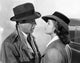 Casablanca movie scene photo print featuring a man and woman in trench coats.