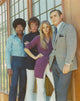Mod Squad Group Photo Print beside a glass window.