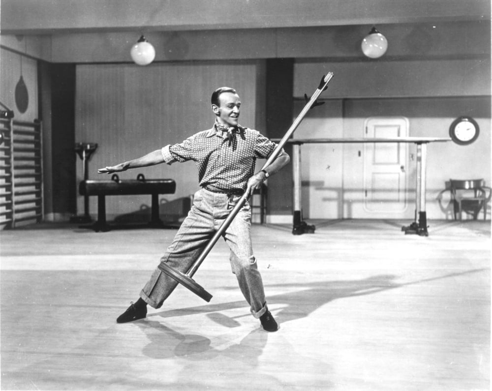 Fred Astaire dancing with a broom in black and white photo print.